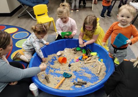 children playing in sand pit