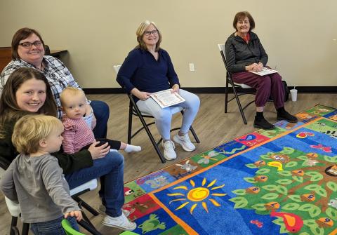 Seniors and children seated together