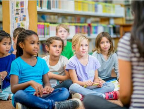 children sat listening to stories