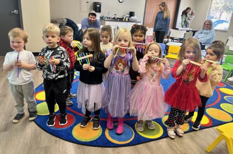 group of children playing hand held flutes