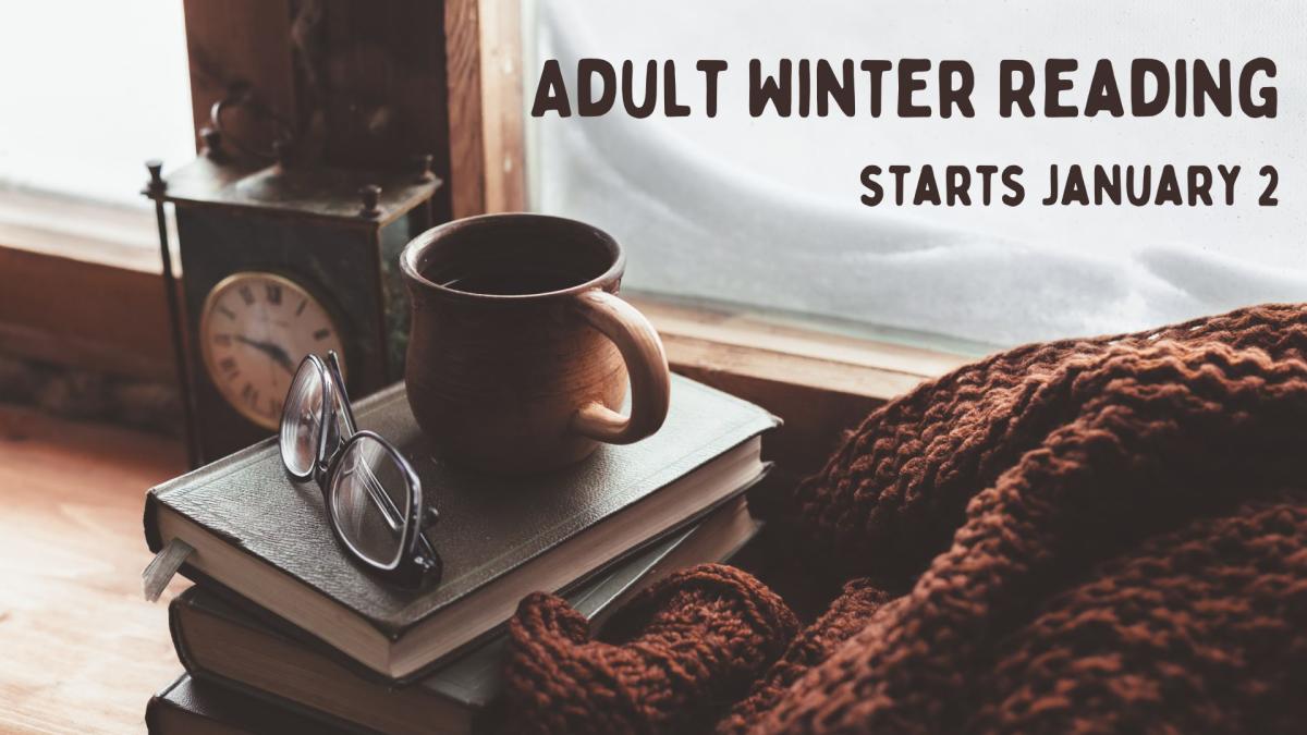 Coffee mug and blanket covering a stack of books