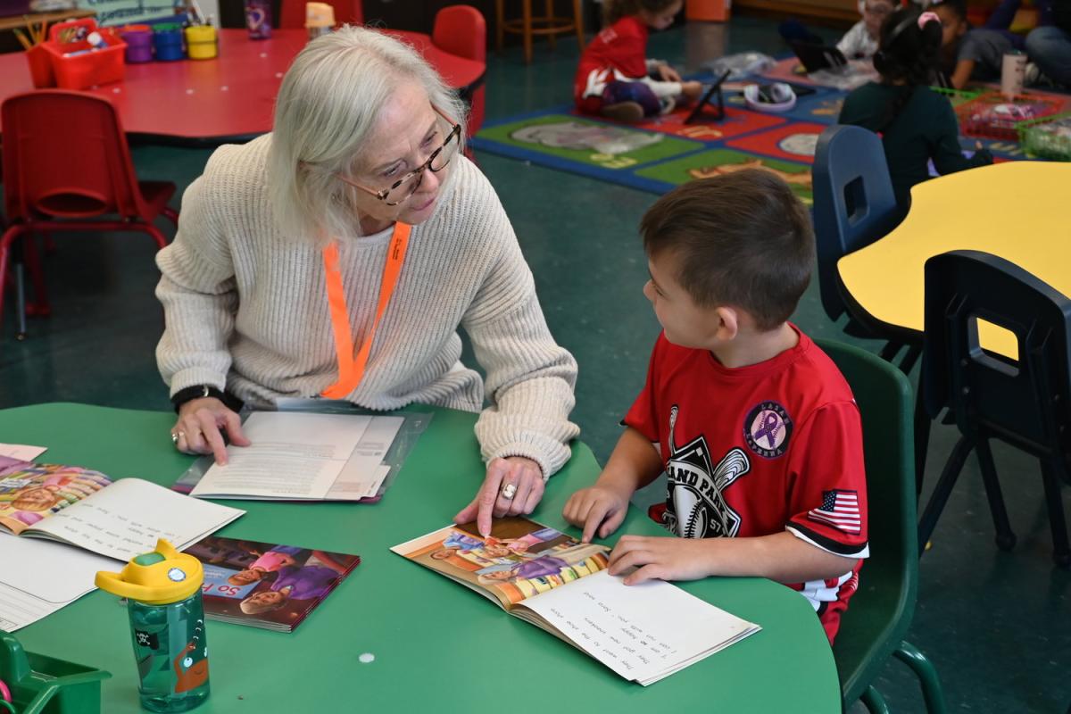 senior adult reading to child